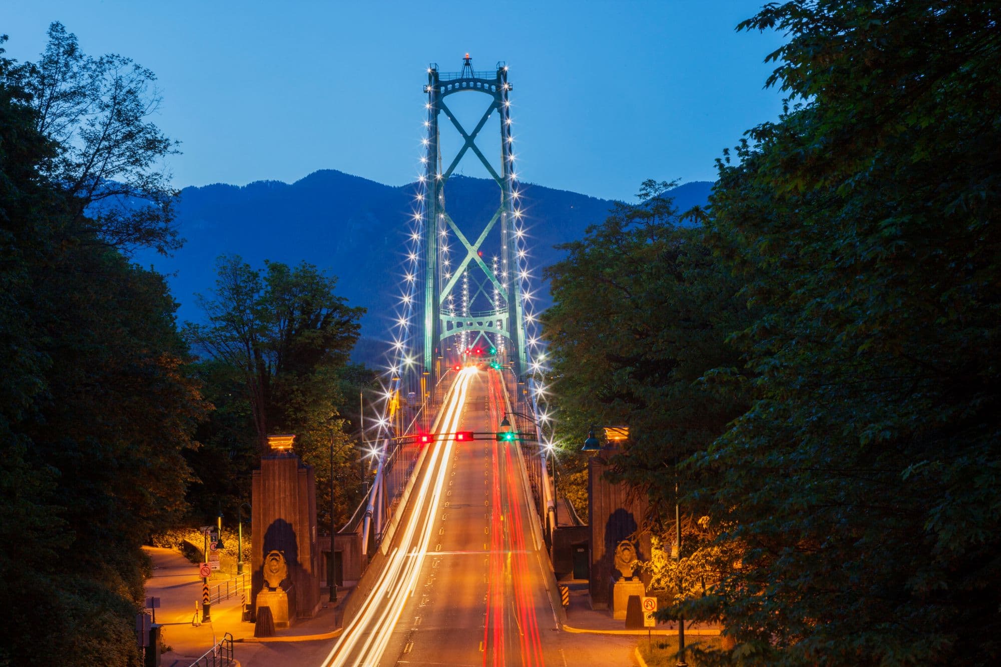 Lions Gate Bridge at dusk with light trails